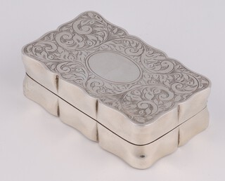 A Victorian style rectangular engraved silver snuff box with scroll decoration and vacant cartouche, Birmingham 1980, 6.5cm, 56 grams