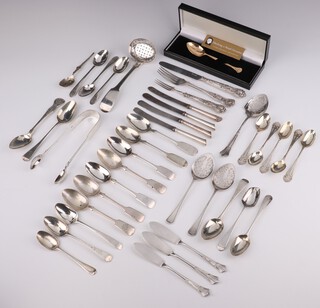 A pair of silver preserve spoons Sheffield 1911, a collection of mixed spoons and forks, 630 grams and 6 silver handled implements 