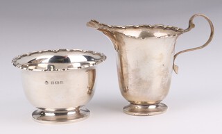 A silver cream jug with S scroll handle and ditto pedestal sugar bowl Birmingham 1939, 120 grams