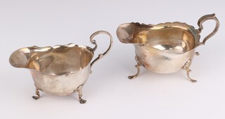 A silver sauce boat Birmingham 1915 and 1 other with rubbed marks, 98 grams 