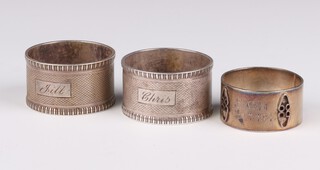 A pair of silver engine turned napkin rings Sheffield 1940 and 1 other, 100 grams 
