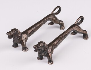A pair of Edwardian silver novelty knife rests in the form of Dachshunds rubbed marks 8cm, 68 grams 