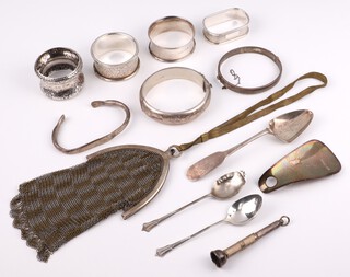 An Edwardian silver napkin ring Sheffield 1901, 3 others, 3 spoons, 2 bangles, a bracelet, shoe horn, a cigar piercer and a 2 coloured plated purse, weighable silver 172 grams 