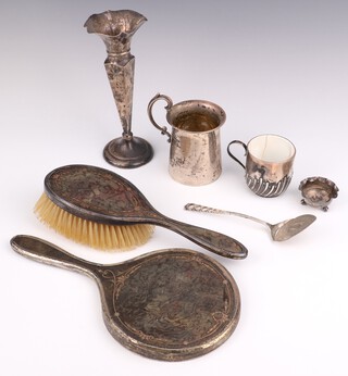 An Edwardian silver mug with S scroll handle, a spill vase, mounted cup, brush, mirror, jam spoon and salt, weighable silver 134 grams 