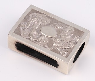 A Chinese repousse silver match box sleeve decorated with a dragon and bamboo 6cm