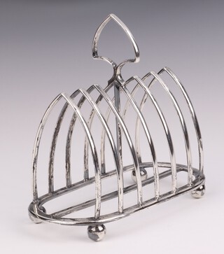 A silver 7 bar toast rack on ball feet Sheffield 1925, 15cm, 244 grams 