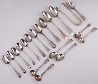 A George III silver teaspoon Newcastle rubbed marks together with a collection of mixed spoons, different makers and dates, 322 grams