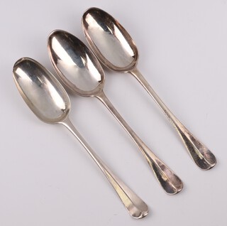 Three early Georgian silver Old English pattern table spoons with armorials, rubbed marks, 180 grams