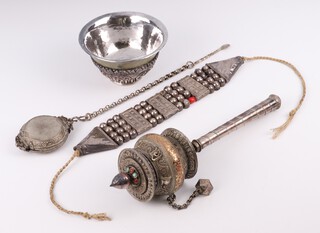 An Eastern white metal and copper prayer wheel, a mounted bowl, box on chain and bracelet 