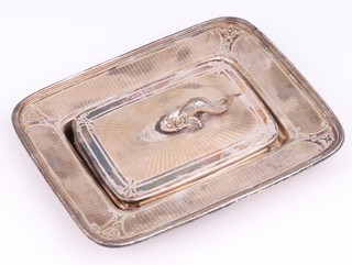 A German silver sardine stand and cover (lacking glass box), stamped FOEHR,  with sea serpent handle, 344 grams 