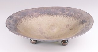 A German 835 standard silver hammer pattern bowl on ball feet, 28cm, 336 grams 