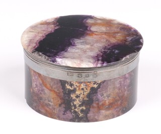 A George IV circular Blue John and silver mounted box, rubbed marks Sheffield 1799 or 1803, 6cm diam. 