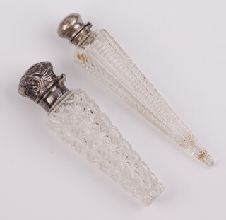 A Victorian silver mounted cut glass tapered scent Birmingham 1899, 9cm and an unmarked ditto 11cm