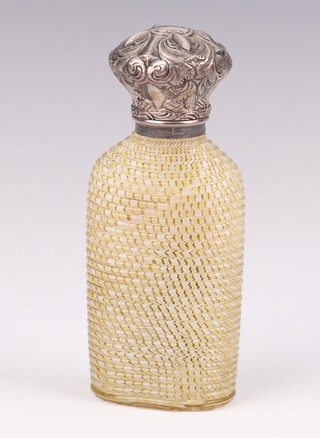 A Victorian basket weave effect coloured glass scent with repousse silver cover 10cm 