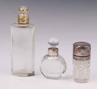 An Edwardian silver mounted cylindrical scent bottle Chester 1907, 5.5cm, a triangular ditto 11cm and a circular ditto 6cm 