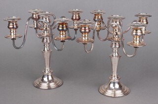 A pair of modern 5 light silver plated candelabra on tapered stems 27cm 
