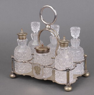 An Edwardian silver plated 6 bottle cruet on bun feet 20cm 