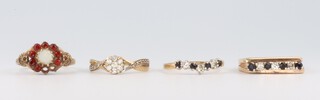 Four 9ct yellow gold gem set rings, sizes L, L, L and M, gross weight 6.6 grams 