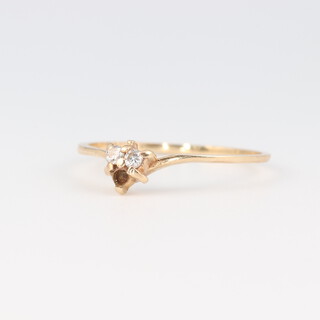 A 9ct yellow gold, 2 (ex 3) stone diamond ring 0.02ct, size L 1/2, 0.7 grams 