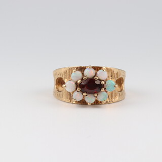 A 9ct yellow gold opal and garnet ring, size N, 3.9 grams 