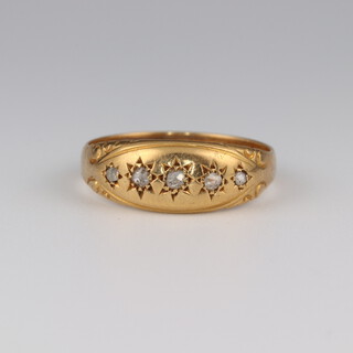An 18ct yellow gold 5 stone diamond ring, 0.09ct, size P 1/2, 3.3 grams