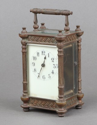 A 19th Century French 8 day carriage timepiece with 5.5cm enamelled dial, Arabic numerals, contained in a gilt metal case complete with key 12cm h x 8cm w x 6cm d 
