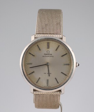 A gentleman's steel cased Omega Automatic deville wristwatch contained in a 35mm case, the movement numbered 37020246, the case numbered 1510039 with a cabochon sapphire winder, on a later mesh bracelet 