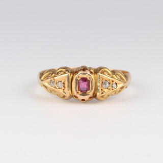 An 18ct yellow gold ruby and diamond ring, the ruby 0.15ct, the diamonds 0.03ct, size Q, 2.7 grams