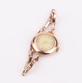A lady's 9ct yellow gold wristwatch with red 12 in a 25mm case, on a gold expanding bracelet, gross weight 22.2 grams, 