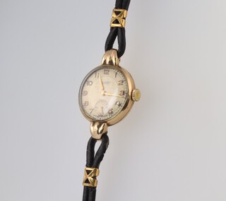 A lady's 9ct yellow gold Rotary wristwatch with seconds at 6 o'clock in a 22mm case on a leather strap 