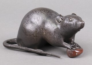 A Meiji Period Japanese bronze figure of a rat holding a nut with character mark to base 18cm 