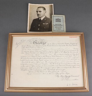A First World War Warrant of Commission to William Frederick Aubrey Snell, Royal Air Force, granting him temporary rank of Second Lieutenant, dated 15th May 1918, framed 89cm x 39cm, together with a Second World War black and white portrait photograph and a Civilian Identity card 