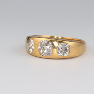 An 18ct yellow gold 3 stone diamond ring, approx 1.75ct, size R, 9 grams 
