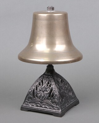 An Air Ministry ambulance/fire engine bell, mounted on a Victorian pierced case iron oil lamp base 30cm h x 19cm 