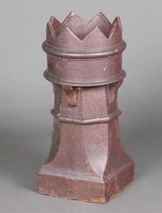 A Victorian brown salt glazed chimney pot with castellated rim 79cm h x 33cm diam. 