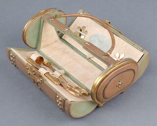 A Victorian rounded rectangular bleached green leather and gilt mounted sewing case, the centre section fitted a bodkin, needle, needle case, scissors, thimble and 2 cotton holders, having 2 flaps to the side - 1 fitted 7 gilt metal and polished steel sewing implements, the other fitted a 4 section purse 7cm h x 18cm w x 9cm d 