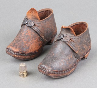 A Victorian pair of wooden and leather childs clogs, possibly Lancashire 