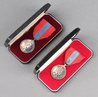 Two Elizabeth II issue Imperial Service medal to Eric John Joseph Martin and Mrs Dorothy May Martin, both boxed and with press cuttings 