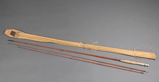 A Hardy C C de France two piece split cane fishing rod, with spare tip, in a cloth carrying case 