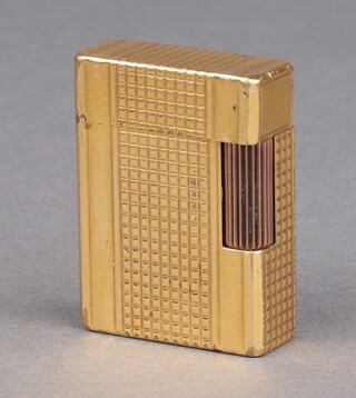 A lady's gilt Dupont cigarette lighter with square cut decoration 5cm