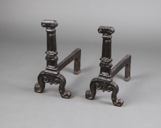 A pair of 18th Century iron fire dogs in the form of Corinthian capitals 56cm h x 46cm w x 28cm d 