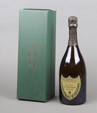 A bottle of 1990 Dom Perignon Vintage champagne, 75cl, 12.5% vol, boxed (the box is dented)