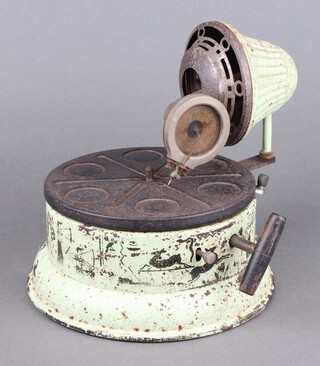 A Nirona tin plate toy gramophone, the cylindrical body decorated transfers of animals and figures 19cm h x 18cm diam. 
