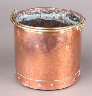 A circular copper coal bin with brass swing handle 29cm h x 31cm diam. 