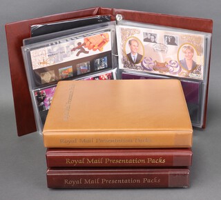 Two hundred and twenty six GB Elizabeth II presentation stamp sets, contained in 4 albums 