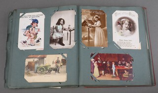 A postcard album containing approx. 154 coloured and black and white postcards, including - English tourist resorts, humorous, etc
