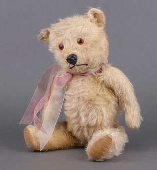 Chiltern Toys, a 1950's Hugmee teddy bear in golden mohair, amber eyes, resin nose and articulated limbs, 34cm 