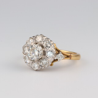 An 18ct yellow gold diamond cluster ring, approx. 1.3ct, size J1/2, 4.2 grams