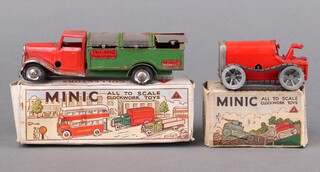 A pair of tin plate Triang Minic vehicles to include 32M refuse collector (red cab, green Body) with delivery lorry box and 11M tractor in red, boxed 