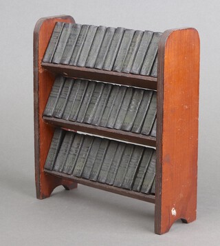 Dickens Charles, a collection of 40 miniature works printed by Allied Newspapers Ltd., contained in a fitted wooden bookcase 64mo., bookcase 23cm h x 20cm w 